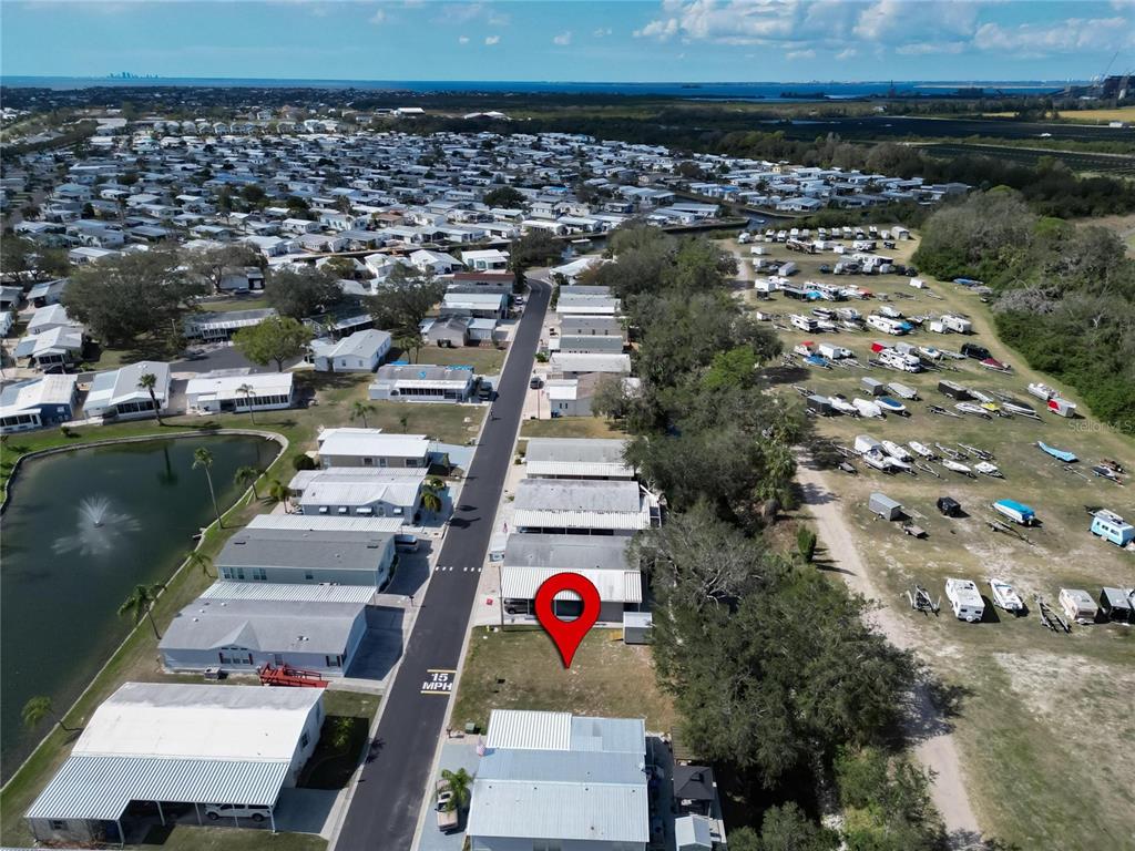 An aerial view shows a mobile home community with a red location pin on a lot — 223 N SAINT GEORGE CIRCLE, APOLLO BEACH, FL