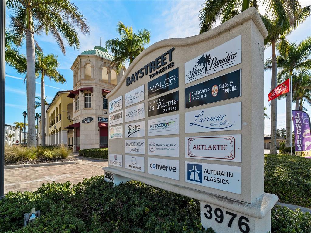 A directory sign for Baystreet Towncenter stands in front of a multi-story commercial building — 3976 DESTINATION DRIVE UNIT 102, OSPREY, FL