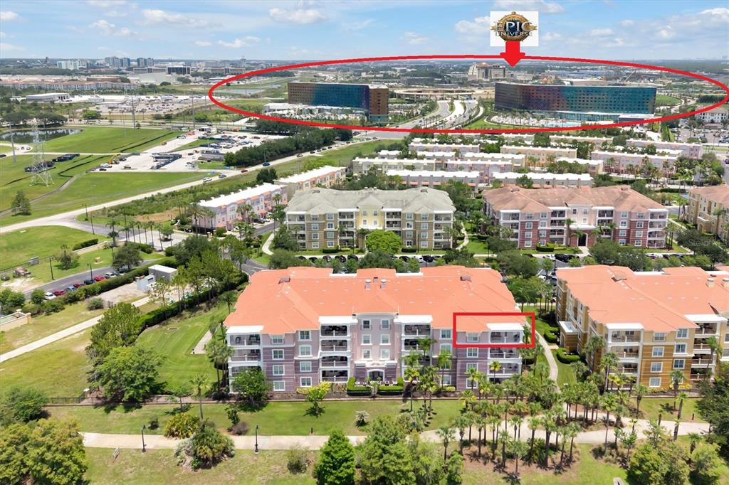An aerial view shows a multi-story apartment complex with a highlighted unit and nearby resort — 5048 SHOREWAY LOOP UNIT 40404, ORLANDO, FL