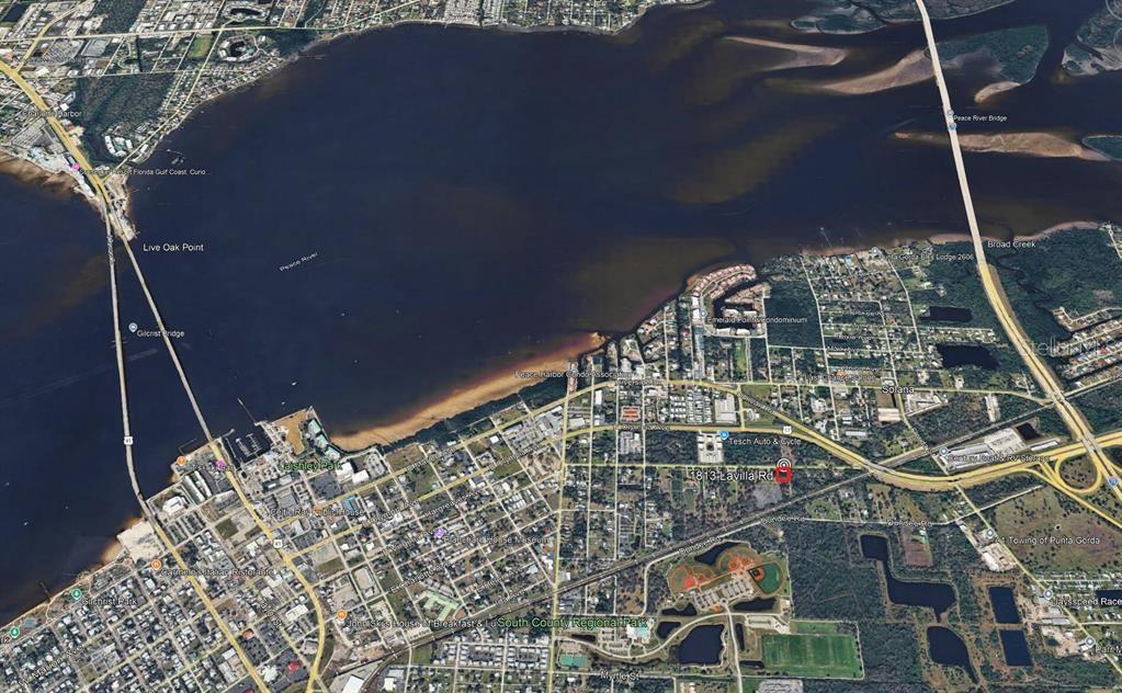 This is an aerial map view of a coastal area featuring a bridge and river — 1813 LAVILLA ROAD, PUNTA GORDA, FL