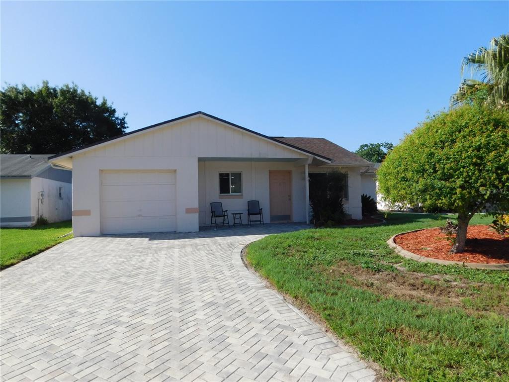 A single-story house with a paved driveway, a one-car garage, and a small front porch — 11226 SCENIC VIEW LANE, ORLANDO, FL