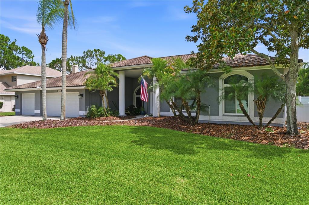 A screened-in patio features a swimming pool, a hot tub, and outdoor seating — 17024 WINNERS CIRCLE, ODESSA, FL