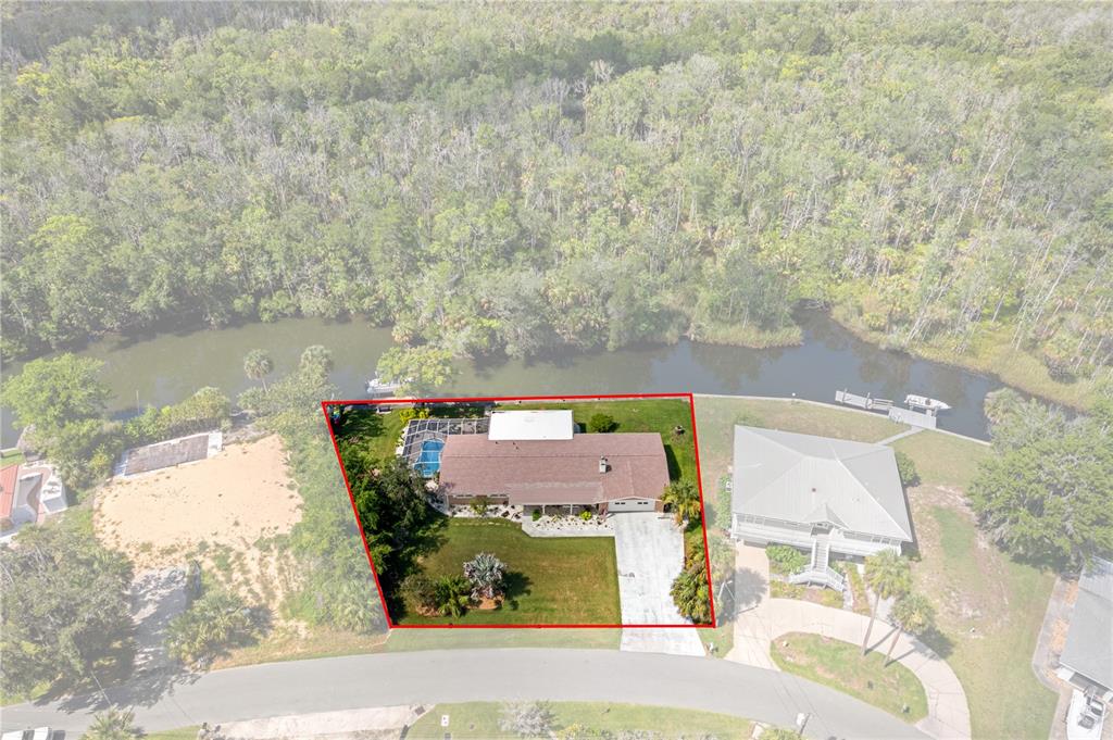 An aerial view shows a house with a pool and a red boundary line — 2160 N WATERSEDGE DRIVE, CRYSTAL RIVER, FL