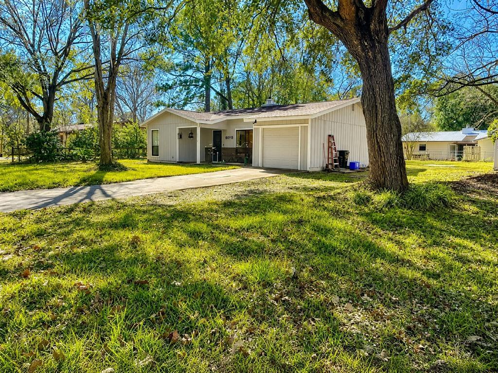 A single-story house with light-colored siding, a front porch, and an attached garage — 6018 NW 26TH TERRACE, GAINESVILLE, FL