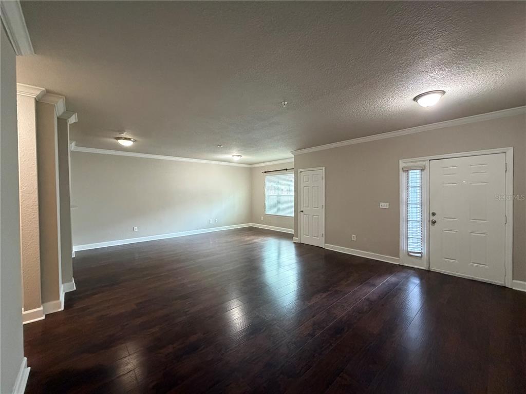 A swimming pool with a shallow entry area sits in a courtyard between apartment buildings — 204 SOUTH STREET UNIT 1053, ORLANDO, FL