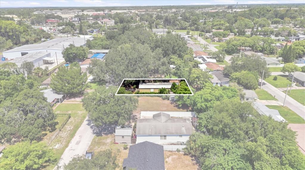 An aerial view shows a residential property with a highlighted rectangular structure and surrounding trees — 8844 MIKE STREET, PORT RICHEY, FL