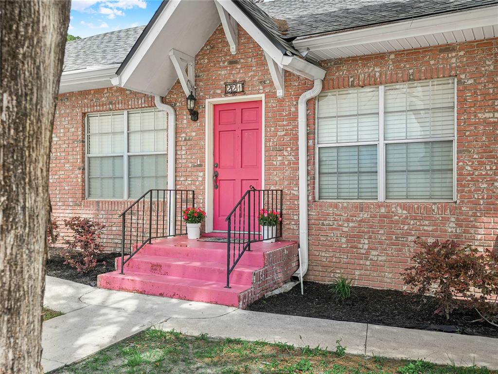 A single-story brick and white siding house with a garage and a large front lawn — 221 CITRUS GROVE BOULEVARD S, POLK CITY, FL