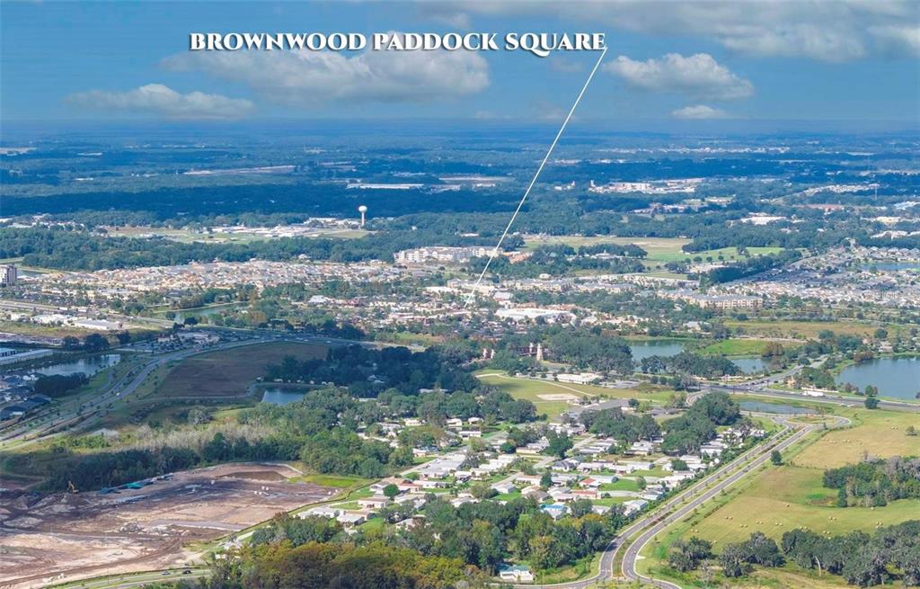 An aerial view shows a residential area with a labeled town square in the distance — LOT 20 BLK D STRATFORD COURT, WILDWOOD, FL
