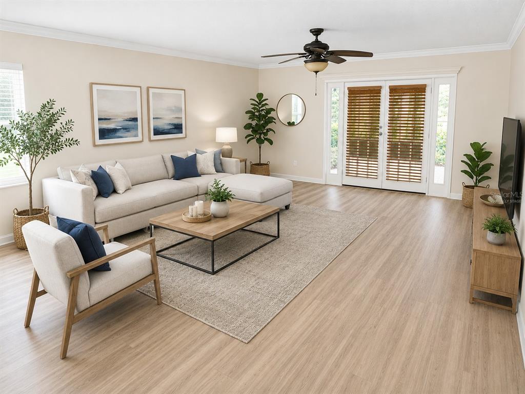 A living room features a sectional sofa, armchair, wood coffee table, and light wood flooring — 1628 BAKER ROAD, LUTZ, FL