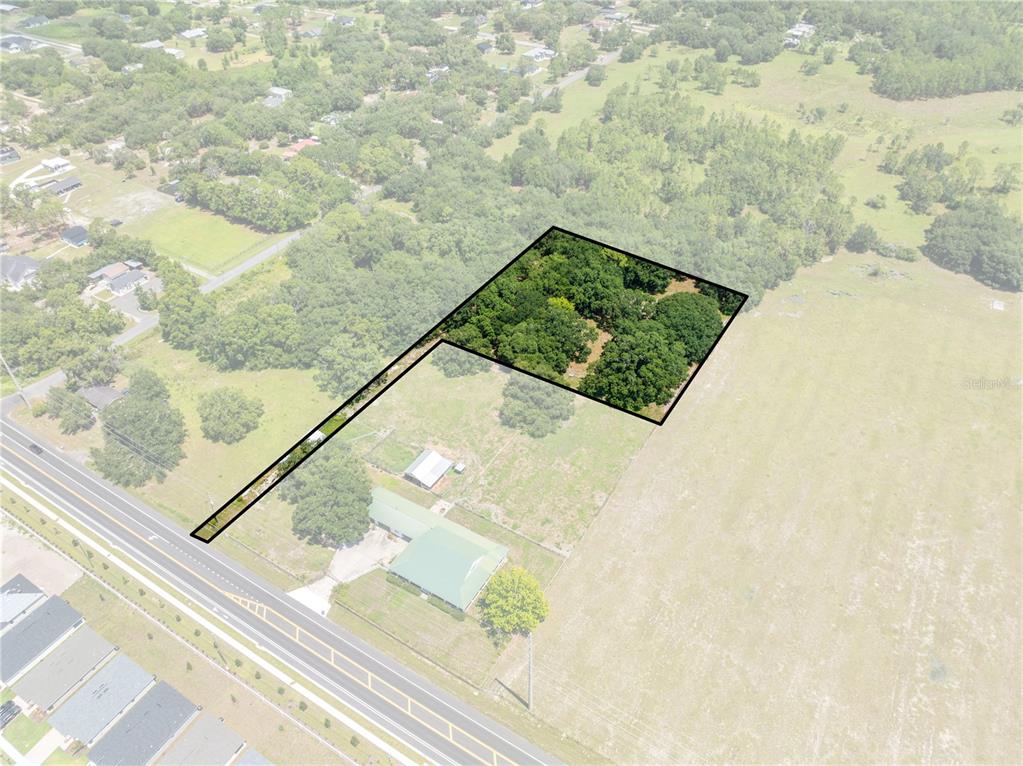 An aerial view shows a flag-shaped lot with a wooded area and a long driveway — 0 HICKORY TREE RD. SAINT CLOUD, FL UNIT 34772, ST CLOUD, FL