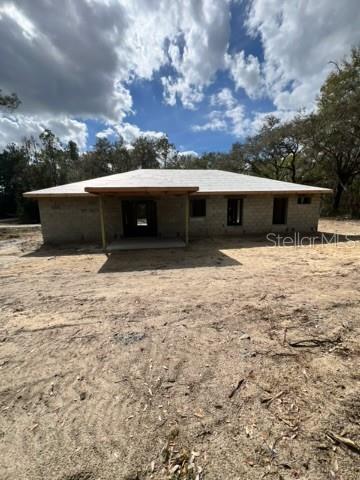 A single-story house under construction with a covered entryway and unfinished exterior walls — 3 GUAVA PASS RUN, OCKLAWAHA, FL