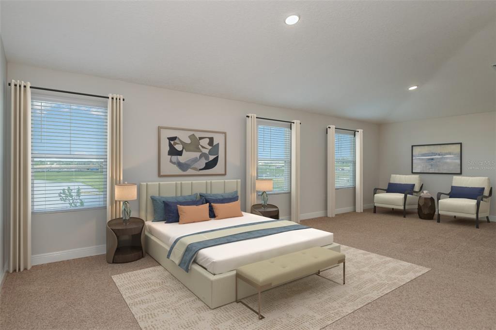 This is a virtually staged bedroom with a bed, two chairs, and three windows — 31717 BIENVILLE LANE, WESLEY CHAPEL, FL