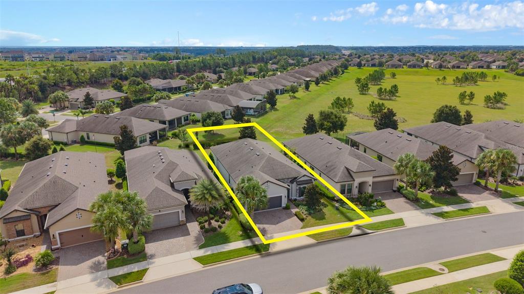 An aerial view shows a single-story suburban house highlighted by a yellow outline — 1197 ESPERANZA RIDGE ROAD, CLERMONT, FL