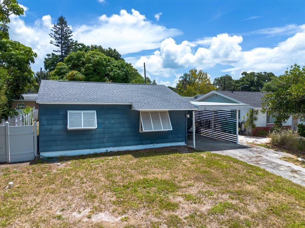 An aerial view of a suburban neighborhood featuring houses, trees, and intersecting streets — 1108 S 55TH STREET, GULFPORT, FL