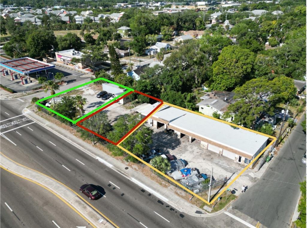 An aerial view shows three adjacent commercial lots with a building and paved parking areas — 1112 1ST STREET W, BRADENTON, FL