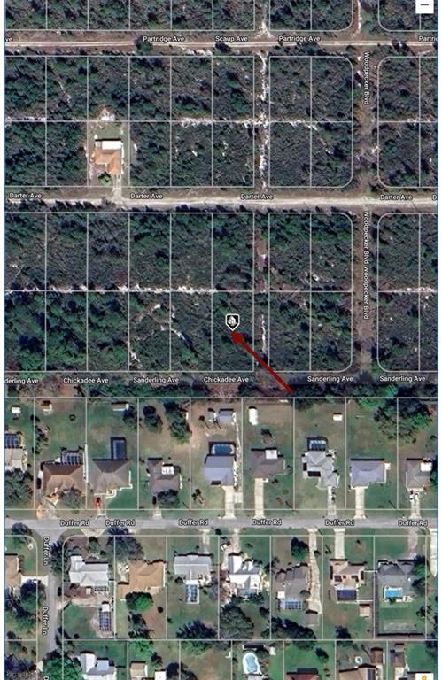 This is an aerial map showing a vacant lot marked with a pin near residential homes — 508 SANDERLING AVENUE, SEBRING, FL