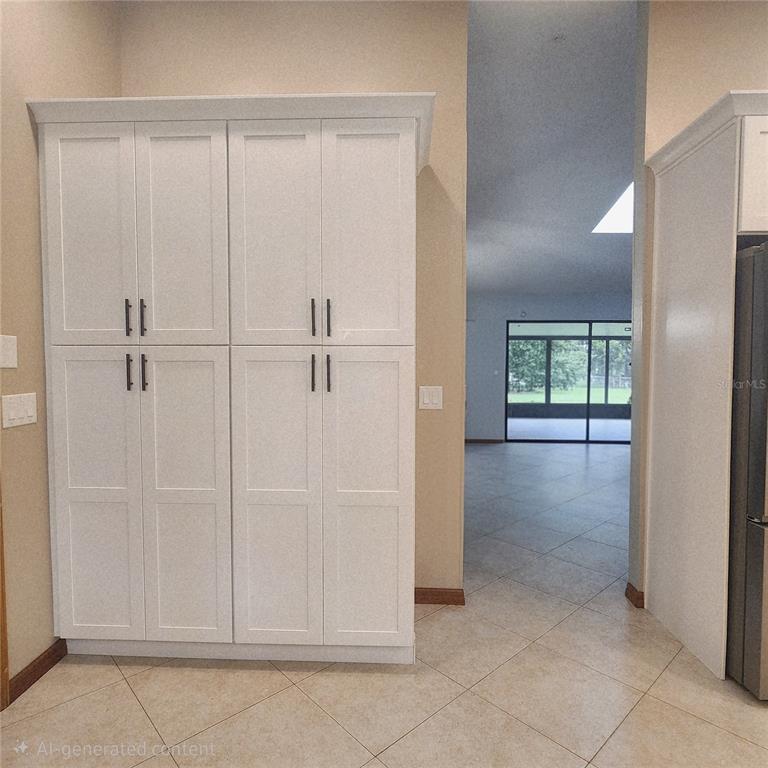 A living room features a stone fireplace, a wooden mantel, and light-colored tile flooring — 2805 LAKE TOHOPEKALIGA BOULEVARD, KISSIMMEE, FL