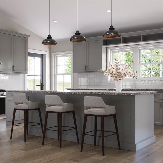 This is a rendering of a kitchen featuring gray cabinets, a central island, and barstools — 3199 S KINGS AVENUE, HOMOSASSA, FL