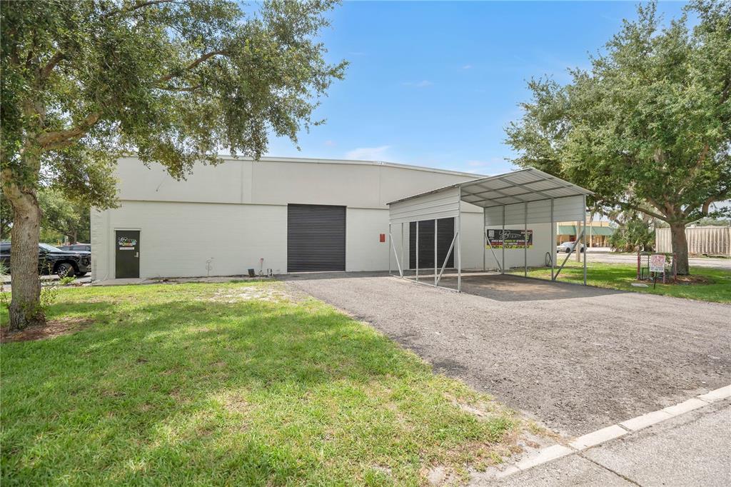 A single-story commercial building with a metal carport and a gravel driveway — 2350 S US HIGHWAY 17 92, LONGWOOD, FL