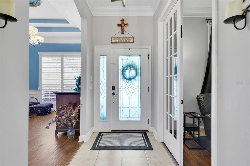 An entryway features a white front door with glass panels, tile flooring, and French doors — 198 PARKSIDE DRIVE, ST AUGUSTINE, FL