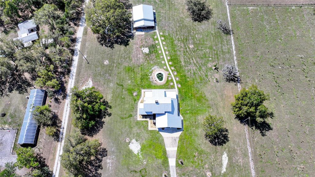 An aerial view shows a house with a metal roof, a pool, and outbuildings — 3049 SW COUNTY ROAD 769, ARCADIA, FL