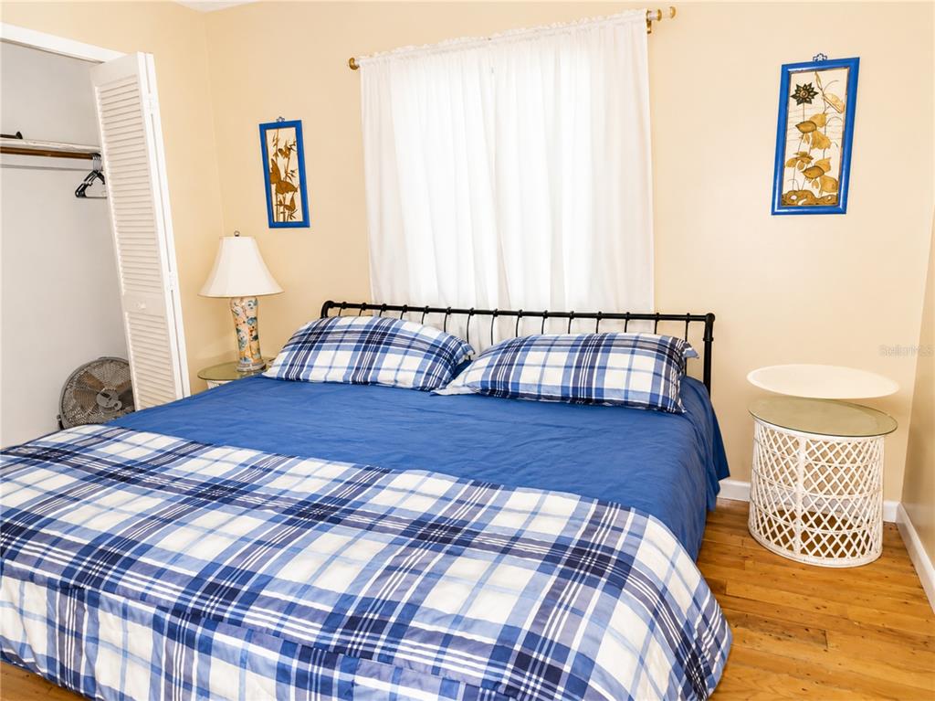 A bathroom features a yellow bathtub and toilet, a white vanity, and tiled walls — 8598 MARSH STREET, PLACIDA, FL