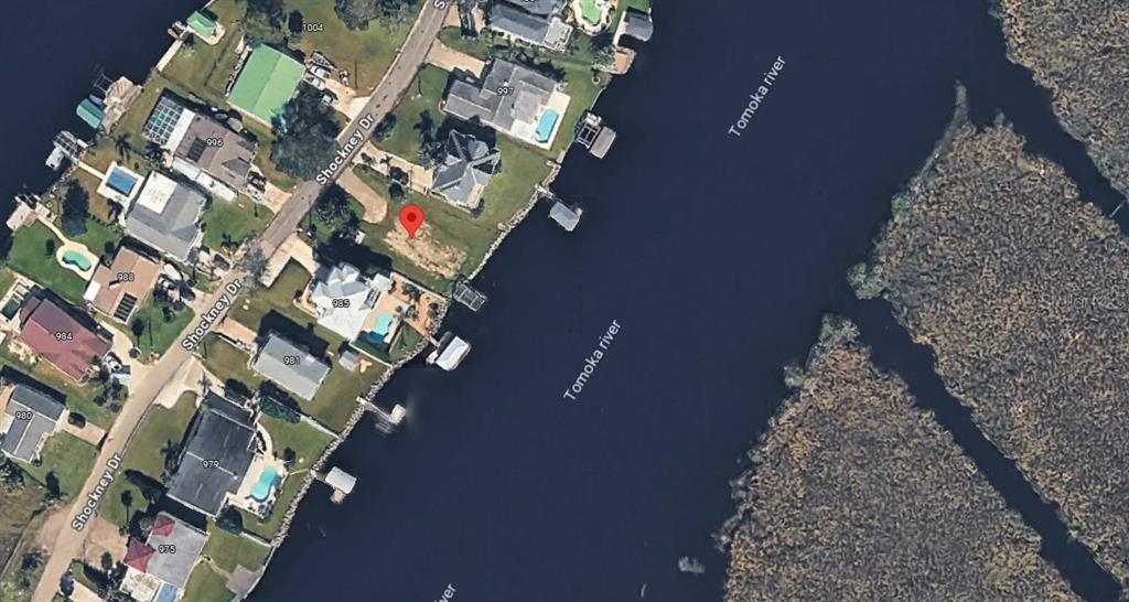 This aerial map shows a vacant waterfront lot located along the Tomoka River — 989 SHOCKNEY DRIVE, ORMOND BEACH, FL