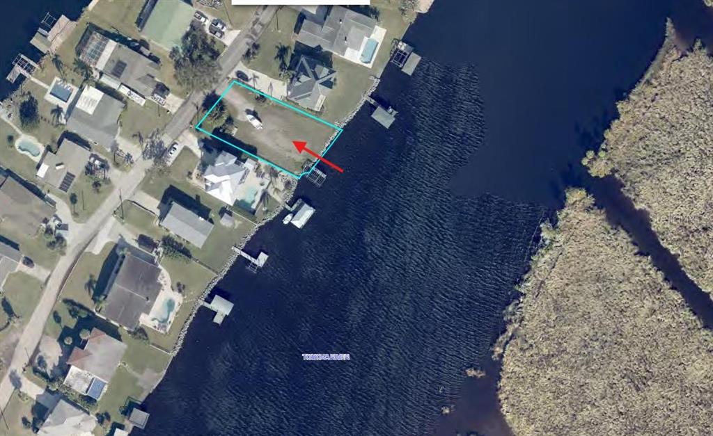 An aerial view shows a vacant waterfront lot along the Weeki Wachee River — 989 SHOCKNEY DRIVE, ORMOND BEACH, FL