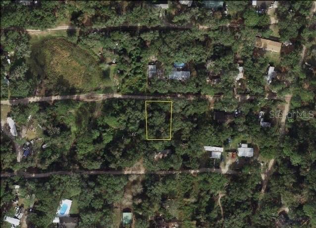 An aerial view of a rectangular, wooded plot of land outlined in yellow — 20745 SE 156 TH PLACE, UMATILLA, FL