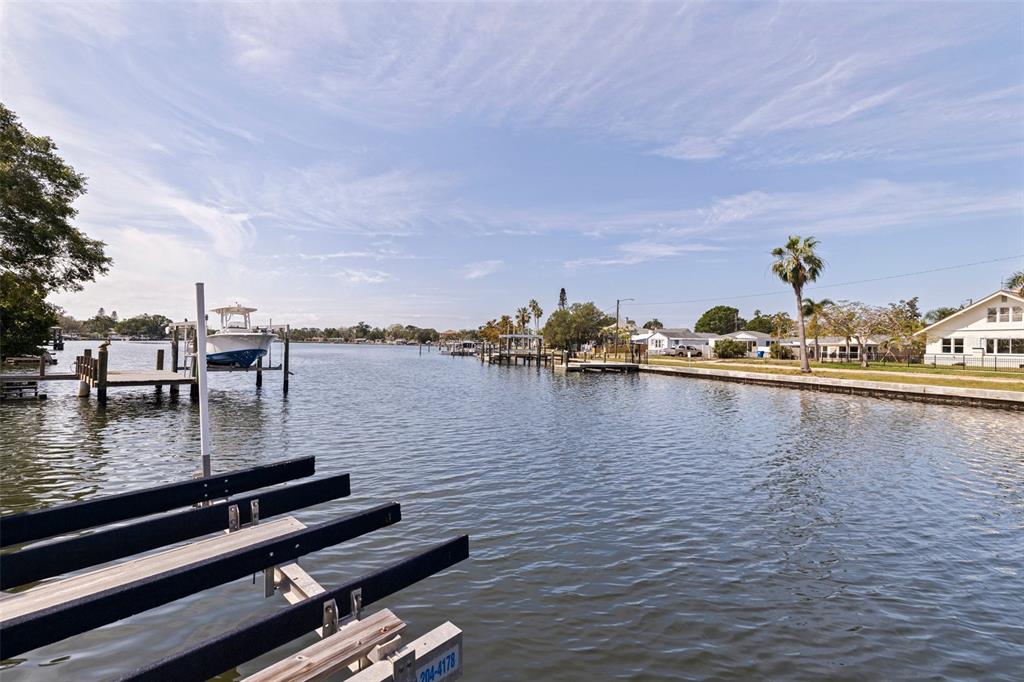 A view of a canal with boat docks and houses along the shoreline — 3931 POMPANO DRIVE SE, ST PETERSBURG, FL