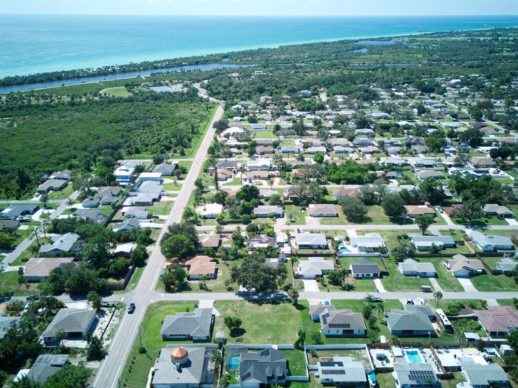 An aerial view shows a residential neighborhood near a coastline with a long road — 0 KIMBALL ROAD, VENICE, FL