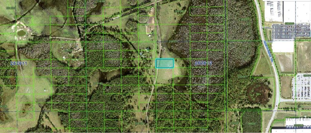 This is an aerial map showing a highlighted rectangular plot of land amidst rural terrain — N/A, DAVENPORT, FL
