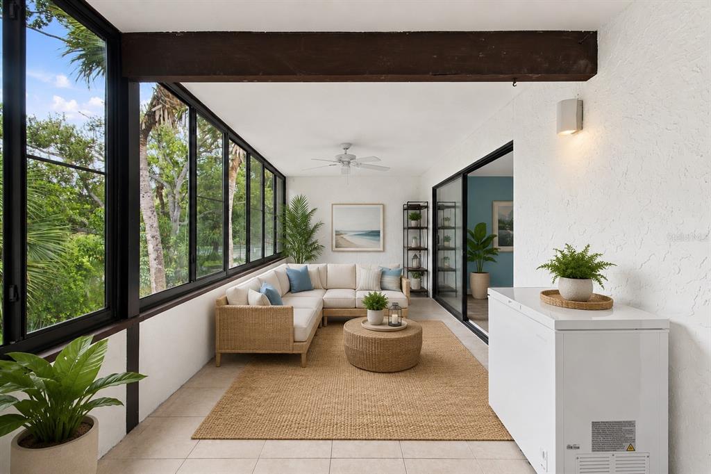 A kitchen features white cabinetry, stainless steel appliances, granite countertops, and a tiled backsplash — 150 PINEHURST DRIVE UNIT 150, BRADENTON, FL