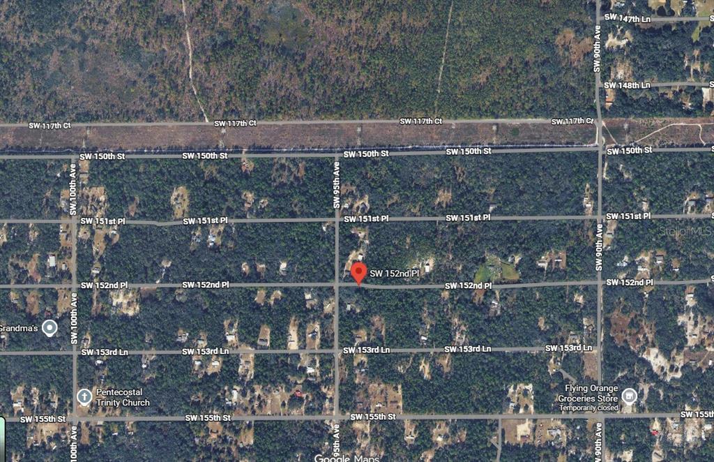 This is a satellite map view showing a residential area with streets and a red marker — TBD SW 152ND PLACE, DUNNELLON, FL