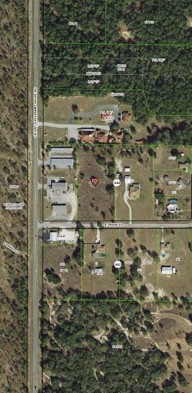 This is an aerial map showing a vacant lot and surrounding properties near a road — 4975 E TRISS STREET, INVERNESS, FL