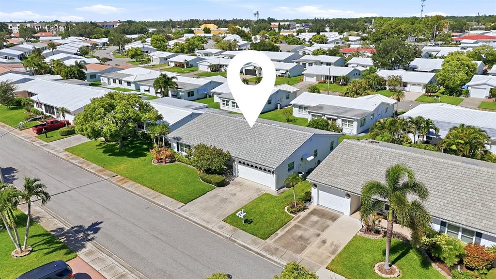 An aerial view shows a residential street with single-story homes and a white location pin — 9304 41ST STREET N, PINELLAS PARK, FL