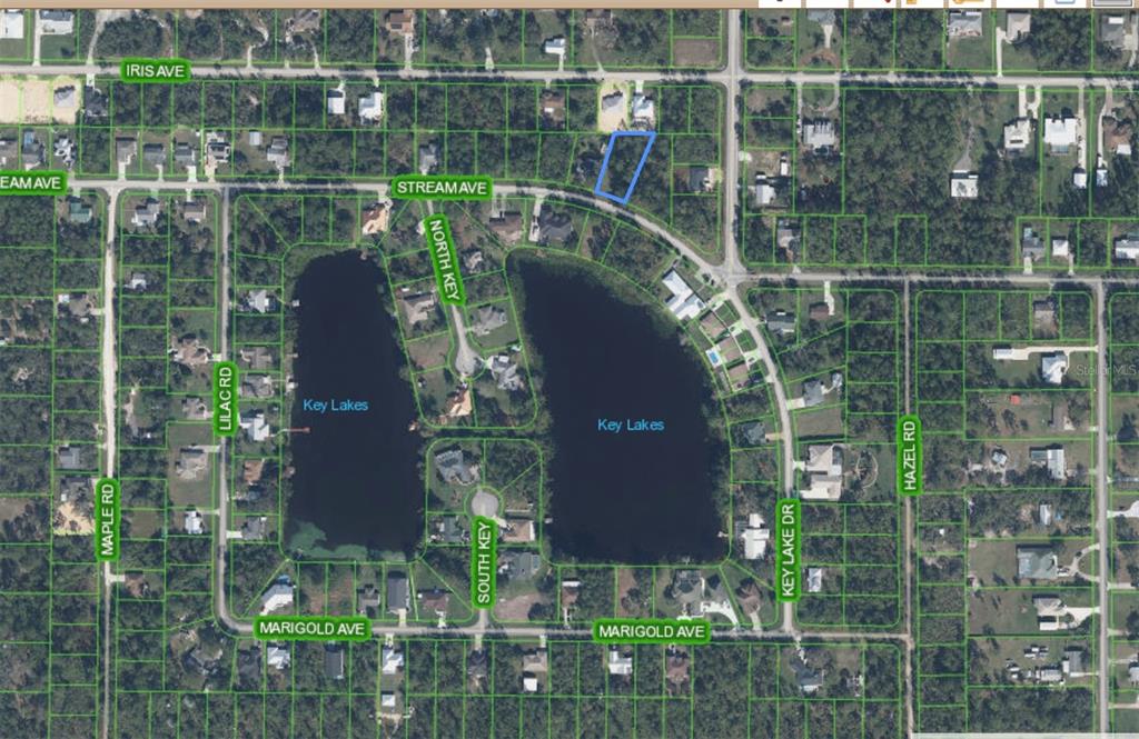 This is an aerial map showing a vacant residential lot highlighted in blue near Key Lakes — 1714 STREAM AVENUE, SEBRING, FL