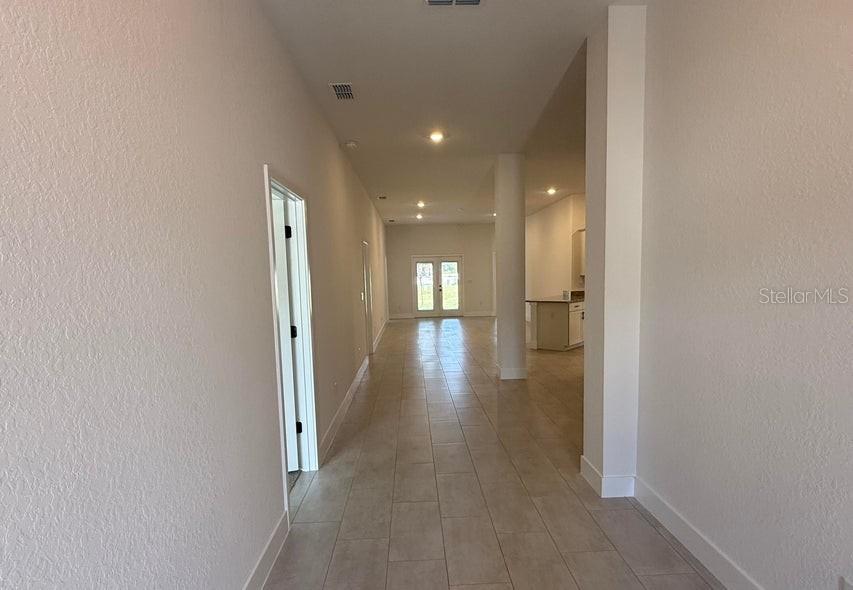 This is a floor plan for a four-bedroom, three-bathroom home with a two-car garage — 11612 GRACE ROAD, WEEKI WACHEE, FL