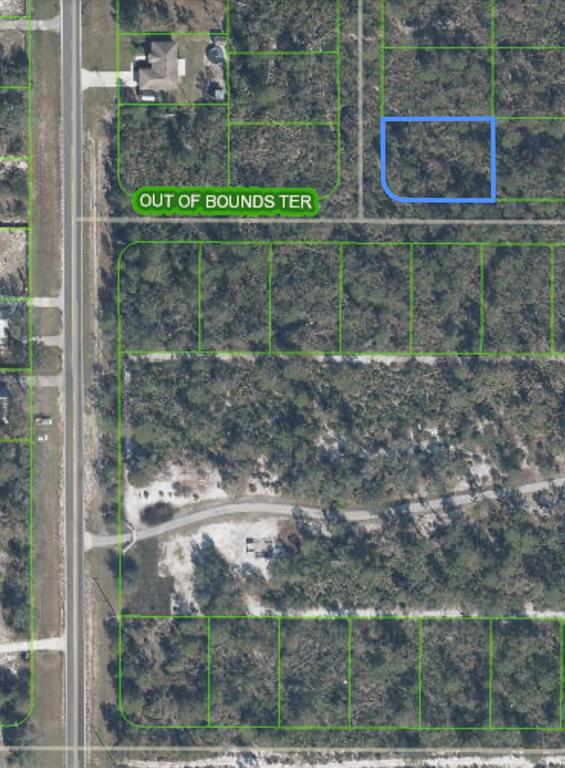 This is an aerial map showing a vacant residential lot outlined in blue — 10662 DEEP HAZARD DRIVE, SEBRING, FL