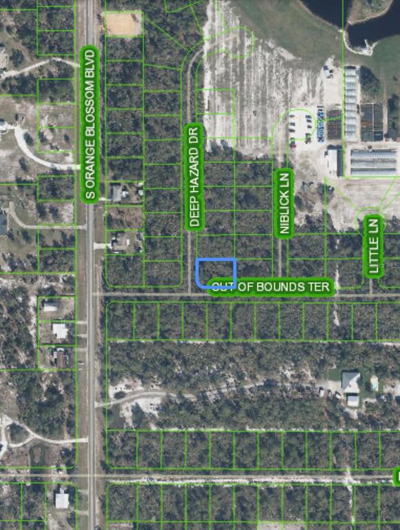 This is a satellite map view showing a vacant residential lot highlighted in blue — 10662 DEEP HAZARD DRIVE, SEBRING, FL