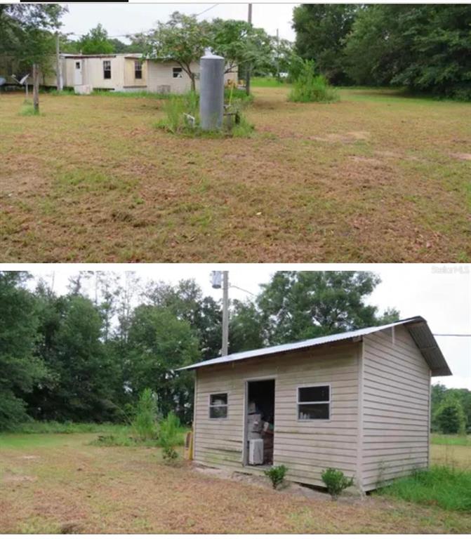 A mobile home and a detached shed sit on a large, grassy lot — 10130 208TH PATH, O'BRIEN, FL