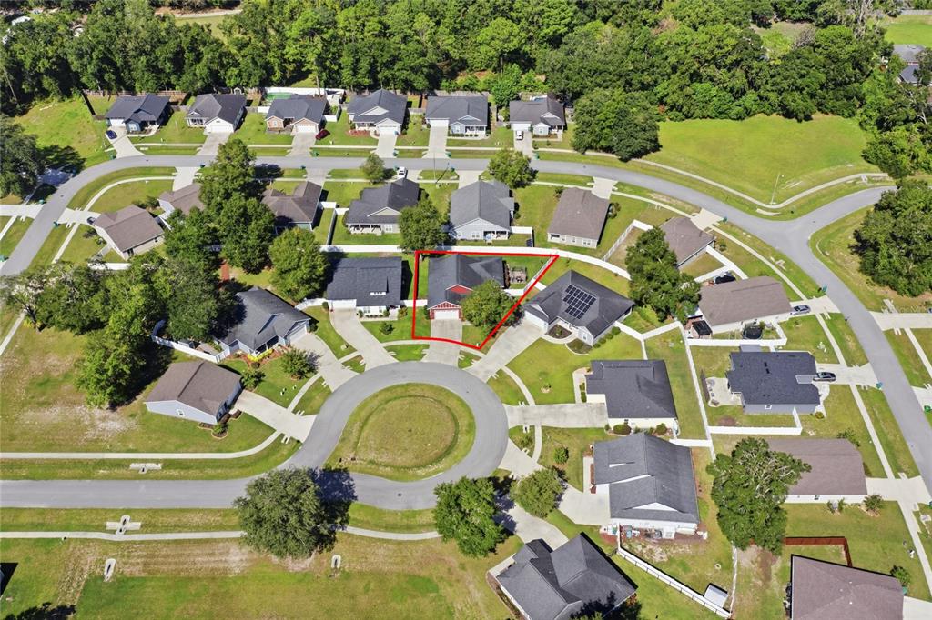 An aerial view shows a suburban house with a red roof outlined in red — 20104 NW 248TH STREET, HIGH SPRINGS, FL