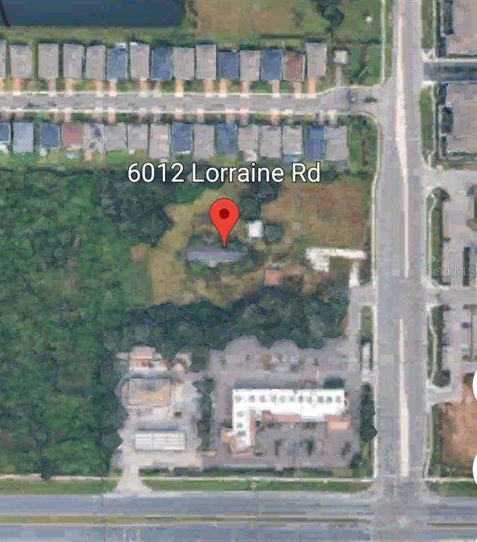 This is an aerial map view showing a residential property lot with surrounding buildings — 6012 LORRAINE ROAD, BRADENTON, FL