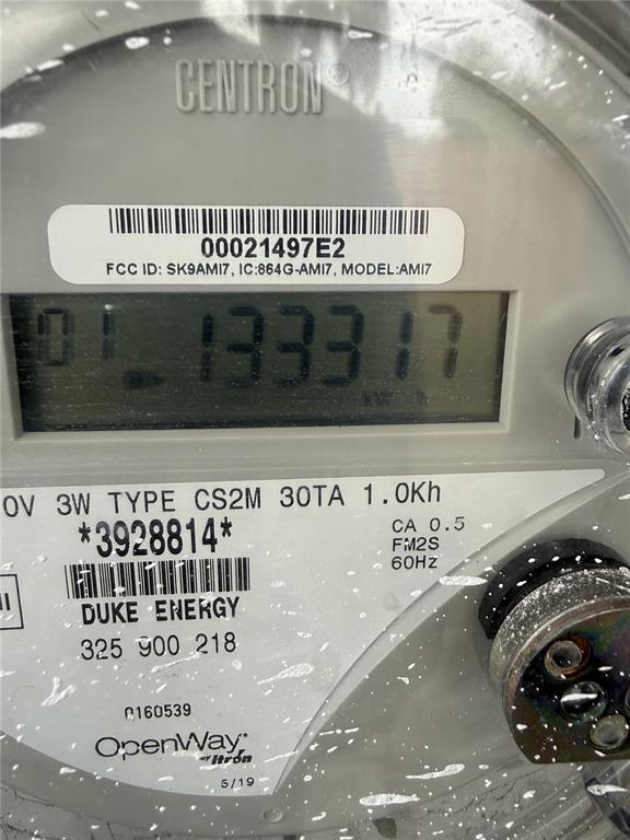 A close-up view of a Duke Energy digital electric meter showing a reading of 1333.17 — 310 E BOOKER STREET, AVON PARK, FL