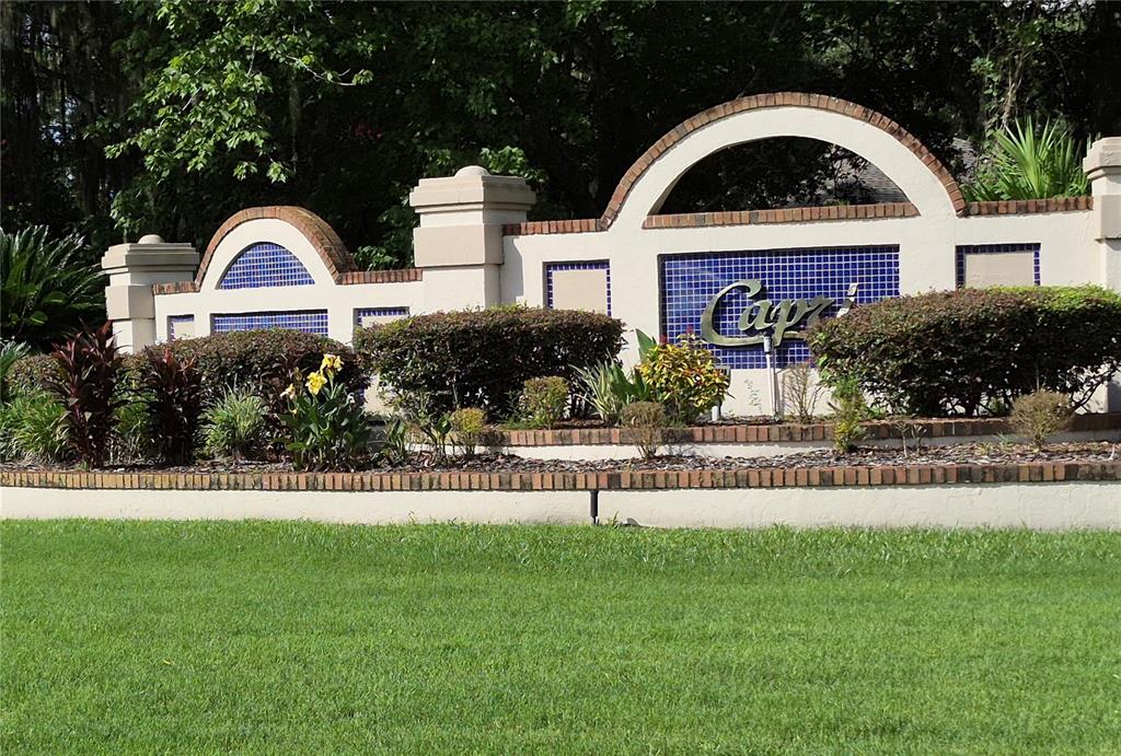 A decorative stucco and brick entrance sign for a community named Capri — 4341 NW 34TH TERRACE, GAINESVILLE, FL