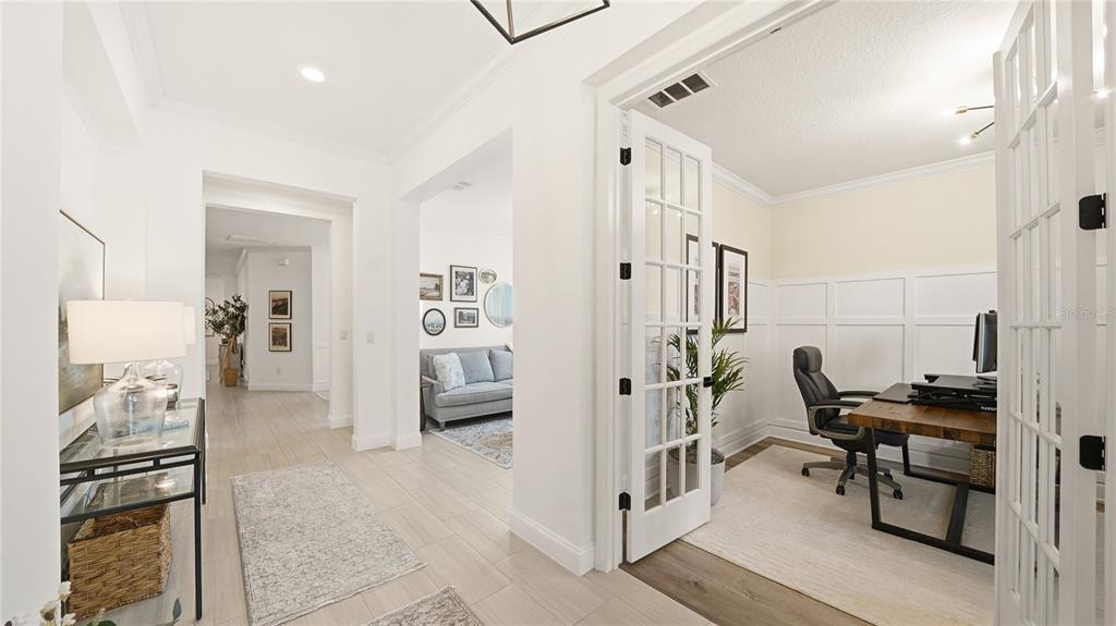 A bright entryway leads to a home office with French doors and a living area — 2931 LAS CALINAS BOULEVARD, ST AUGUSTINE, FL