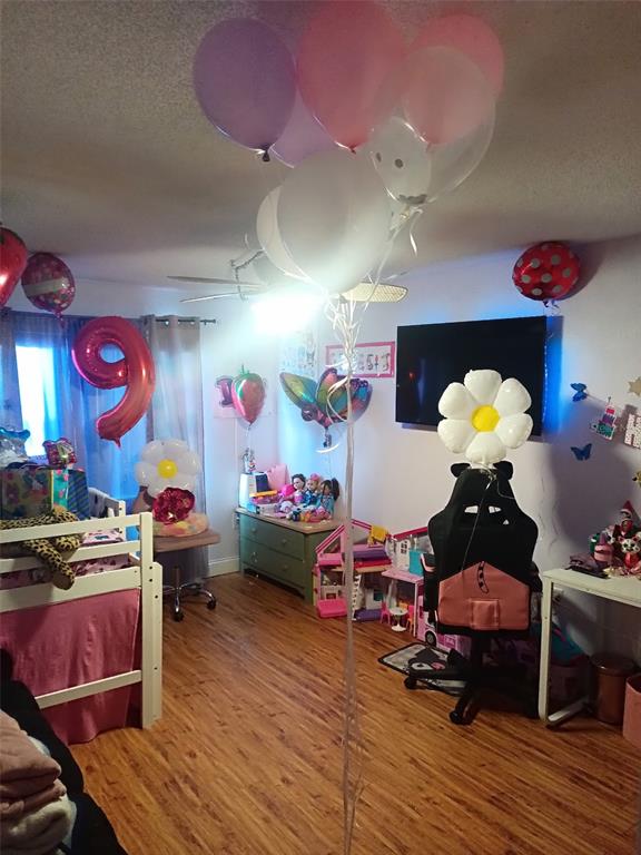 A child's bedroom features a bunk bed, a gaming chair, and numerous colorful party balloons — 3354 SCORECARD DRIVE, NEW PORT RICHEY, FL