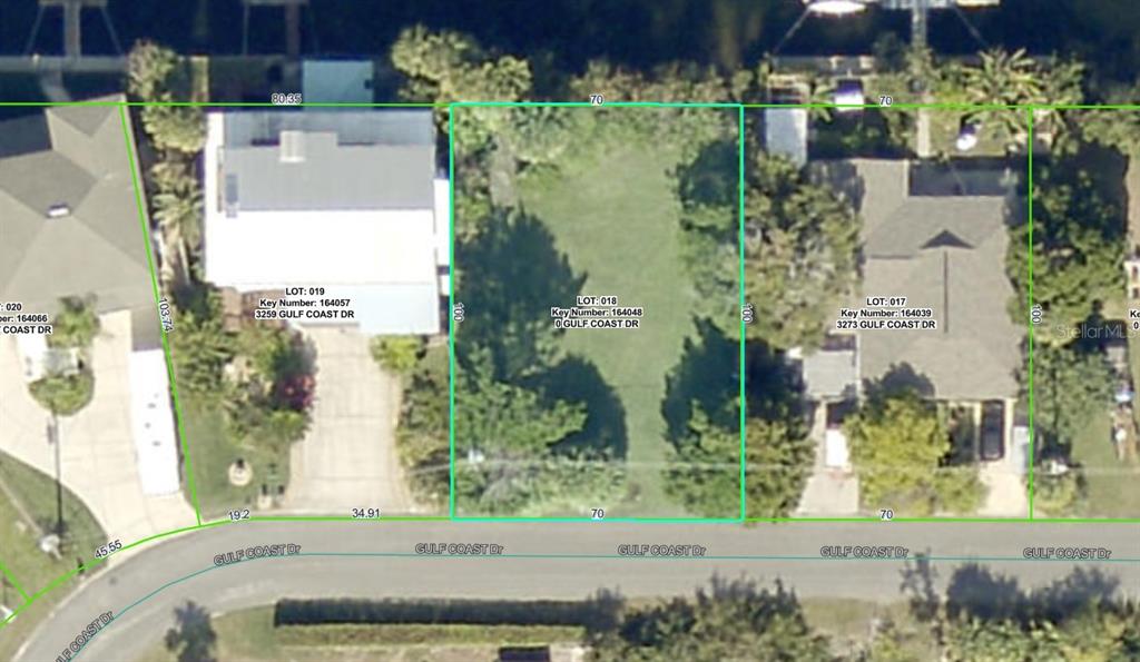 This is an aerial map showing a vacant residential lot between two developed properties — 3265 GULF COAST DRIVE, HERNANDO BEACH, FL