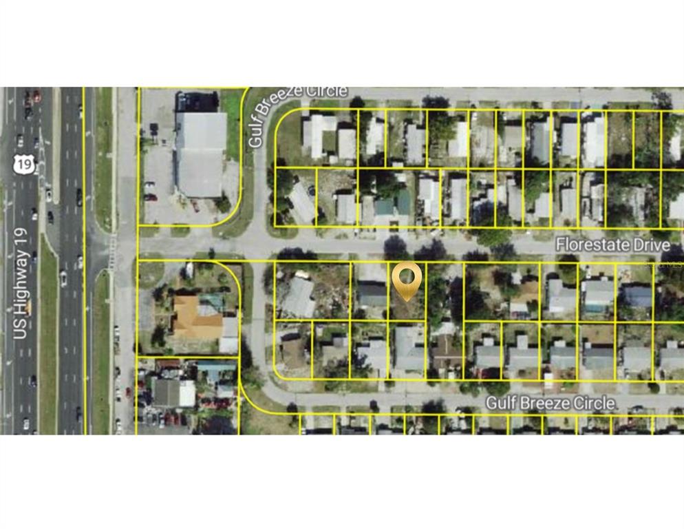 This is an aerial map view showing a vacant lot marked with a location pin — FLORESTATE, HUDSON, FL