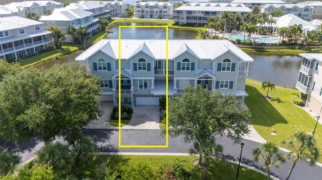 An aerial view shows a multi-story townhouse unit highlighted by a yellow rectangle — 10307 CORAL LANDINGS LANE UNIT 11, PLACIDA, FL